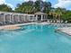 Community pool with ample seating, pergola, and gazebo at 8350 Sw 93Rd Ln # C, Ocala, FL 34481