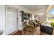 Inviting front porch with comfortable seating, stylish decor, and a welcoming ambiance at 8350 Sw 93Rd Ln # C, Ocala, FL 34481