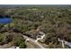 Lush acreage with wooded homesite featuring circular drive near a lake and nature preserve at 8380 Se 7Th Avenue Rd, Ocala, FL 34480