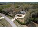 Aerial view of a secluded property featuring a circular driveway and mature trees at 8380 Se 7Th Avenue Rd, Ocala, FL 34480