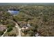 Lush acreage with wooded home site featuring circular drive near a lake and nature preserve at 8380 Se 7Th Avenue Rd, Ocala, FL 34480