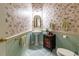 Charming powder room features floral wallpaper, a pedestal sink and vintage-style fixtures at 8380 Se 7Th Avenue Rd, Ocala, FL 34480