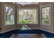 Bay window area showcasing a charming gazebo amidst lush backyard greenery at 8380 Se 7Th Avenue Rd, Ocala, FL 34480