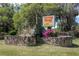 Turning Hawk Ranches community sign with lush landscaping and stone detail at 8380 Se 7Th Avenue Rd, Ocala, FL 34480