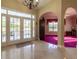 Elegant foyer featuring marble floors leading to a formal living area with oversized doors to the rear at 8380 Se 7Th Avenue Rd, Ocala, FL 34480