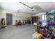 Well-lit garage space with ample room for storage, featuring an exit door at 8380 Se 7Th Avenue Rd, Ocala, FL 34480