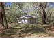 Detached garage offering convenient parking and storage space on a wooded lot at 8380 Se 7Th Avenue Rd, Ocala, FL 34480