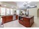 A bright kitchen featuring granite countertops, a central island, and stainless steel appliances at 8380 Se 7Th Avenue Rd, Ocala, FL 34480