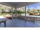 Covered porch with swing overlooking the expansive front yard of this gorgeous property at 8380 Se 7Th Avenue Rd, Ocala, FL 34480