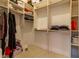 Spacious walk-in closet with built-in shelving, providing ample storage for clothing and accessories at 8380 Se 7Th Avenue Rd, Ocala, FL 34480