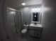 Modern bathroom offers a glass-enclosed shower, updated vanity, and decorative tile at 8890 Sw 33Rd Ct, Ocala, FL 34476