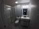 Stylish bathroom features modern fixtures, a glass-enclosed shower, and patterned tile at 8890 Sw 33Rd Ct, Ocala, FL 34476