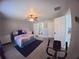 Spacious bedroom boasts an ensuite bathroom, walk-in closet, and wood-look floors at 8890 Sw 33Rd Ct, Ocala, FL 34476