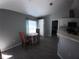 Cozy dining area with table, chairs, and natural light; next to kitchen and bedroom entrances at 8890 Sw 33Rd Ct, Ocala, FL 34476