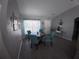 Cozy dining area featuring a round table, four chairs, and natural light at 8890 Sw 33Rd Ct, Ocala, FL 34476