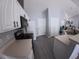Well-lit kitchen featuring white cabinets, modern appliances, and a view into the living area at 8890 Sw 33Rd Ct, Ocala, FL 34476