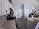 Modern kitchen with white cabinets, stainless steel appliances, and hardwood floors at 8890 Sw 33Rd Ct, Ocala, FL 34476