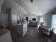 Spacious living room with a bar, dining area, comfortable seating, and natural light at 8890 Sw 33Rd Ct, Ocala, FL 34476