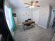 Bright home office with a wooden desk, ceiling fan, and functional storage at 8890 Sw 33Rd Ct, Ocala, FL 34476