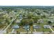 An aerial neighborhood shot displaying single-Gathering homes with large, green lawns and mature trees at 8917 Sw 101St Ln, Ocala, FL 34481