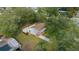 An aerial view of a charming single-Gathering home nestled among mature trees at 8917 Sw 101St Ln, Ocala, FL 34481