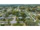 A neighborhood with mature trees, well-maintained homes, and paved roads in an aerial view at 8917 Sw 101St Ln, Ocala, FL 34481