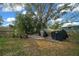 A backyard with a foliage and grill for outdoor activities at 8917 Sw 101St Ln, Ocala, FL 34481