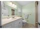 Bright bathroom with a vanity, tiled flooring, and a combination shower and tub at 8917 Sw 101St Ln, Ocala, FL 34481