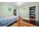 Bedroom boasts hardwood floors, a ceiling fan, a glass desk and a closet for ample storage at 8917 Sw 101St Ln, Ocala, FL 34481