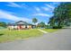 Charming community clubhouse with a well-manicured lawn and walkway, providing a welcoming gathering space at 8917 Sw 101St Ln, Ocala, FL 34481