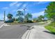 Street view of community entrance sign surrounded by lush landscaping, inviting you to your new home at 8917 Sw 101St Ln, Ocala, FL 34481