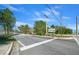 Street view of community entrance sign surrounded by lush landscaping, welcoming you to your new home at 8917 Sw 101St Ln, Ocala, FL 34481