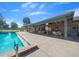 Community pool with adjacent covered patio area with tables and chairs perfect for relaxing and enjoying the outdoors at 8917 Sw 101St Ln, Ocala, FL 34481