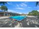 Inviting community pool with surrounding lounge area, perfect for swimming, sunbathing, and socializing at 8917 Sw 101St Ln, Ocala, FL 34481