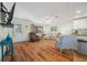 Inviting living room with hardwood floors, comfortable seating, and plenty of light at 8917 Sw 101St Ln, Ocala, FL 34481