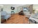 Cozy living room featuring hardwood floors, a large window and comfortable seating at 8917 Sw 101St Ln, Ocala, FL 34481