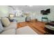 Open-concept living area with hardwood floors and plenty of natural light at 8917 Sw 101St Ln, Ocala, FL 34481