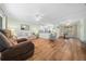 Spacious living room with hardwood floors, ceiling fans, and natural light at 8917 Sw 101St Ln, Ocala, FL 34481