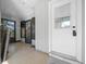 Inviting enclosed front porch with white door and windows, perfect for relaxing in any weather at 8917 Sw 101St Ln, Ocala, FL 34481