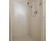 Shower featuring tiled walls and floor and a sleek shower head at 8917 Sw 101St Ln, Ocala, FL 34481