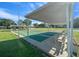 Outdoor shuffleboard courts with an overhead covering, providing a fun, shaded activity area in this community at 8917 Sw 101St Ln, Ocala, FL 34481