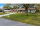 Quaint home with an American flag, well-kept lawn, and convenient carport, set in a peaceful neighborhood at 8917 Sw 101St Ln, Ocala, FL 34481