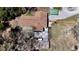 Aerial view of backyard deck, patio, storage shed and wooden privacy fence highlighting property features at 10370 Sw 110Th St, Dunnellon, FL 34432