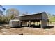 Barn featuring picnic tables and storage space underneath open shelter at 10370 Sw 110Th St, Dunnellon, FL 34432
