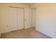 This bedroom features carpet, a closet and neutral colored walls at 10370 Sw 110Th St, Dunnellon, FL 34432