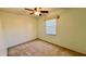 Cozy bedroom with soft green walls, carpet flooring, and a ceiling fan at 10370 Sw 110Th St, Dunnellon, FL 34432