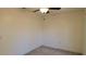 Cozy bedroom with neutral walls, carpet flooring, and a ceiling fan at 10370 Sw 110Th St, Dunnellon, FL 34432