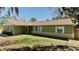 Charming single-story home features a brick foundation and verdant lawn under a clear, sunny sky at 10370 Sw 110Th St, Dunnellon, FL 34432