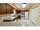 Bright kitchen features ample counter space, white appliances, a gas range, and matching cabinets at 10370 Sw 110Th St, Dunnellon, FL 34432
