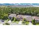 Scenic aerial view of a residential area with houses surrounded by lush green trees at 1073 Vinsetta Cir, Winter Garden, FL 34787